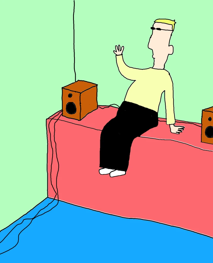 A blond figure in sunglasses sits between two orange speakers on a pink ledge, raising one hand in a room with green walls and a blue floor.